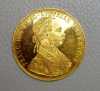 Zlatá mince o ryzosti dukátového zlata - Au 986/1000. Průměr: 39,5 mm, hmotnost: 13,9639 g. Líc: Císař František Josef I. s vavřínovým věncem hledící vpravo, text: FRANC IOS I D G AVSTRIAE IMPERATOR. Rub: Rakousko-uherský dvouhlavý orel, text: HVNGAR BOHEM GAL (4) - LOD ILL REX A A 1915. Emitent: Rakousko. Rok: 1915 - novoražba. 

